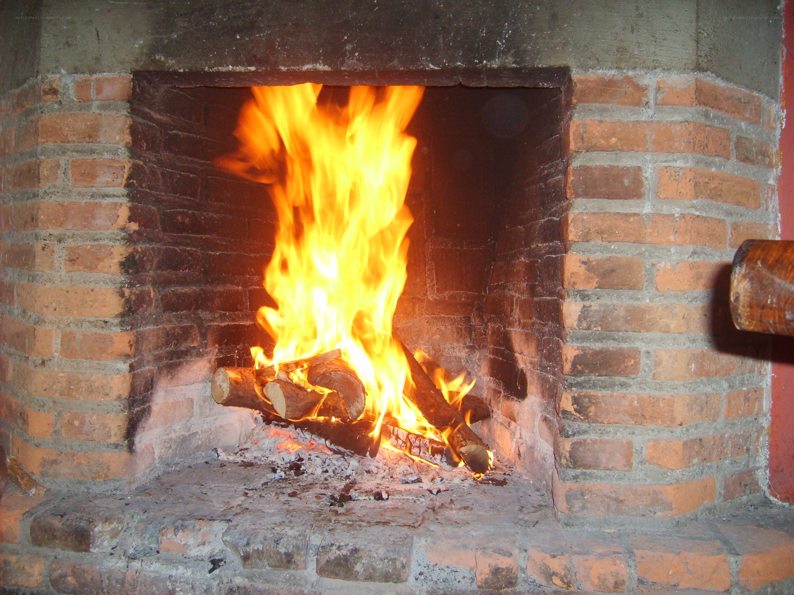 Fire burning in a brick fireplace