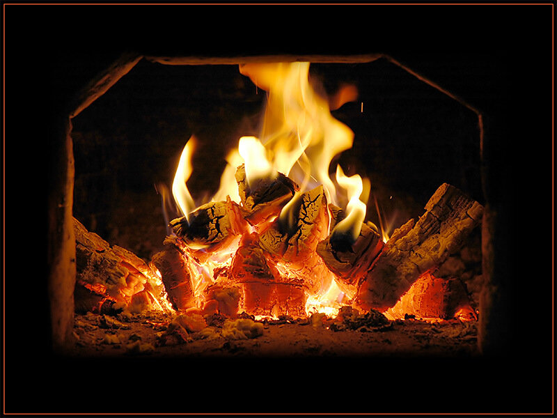 Fire Burning in Fireplace — Photograph