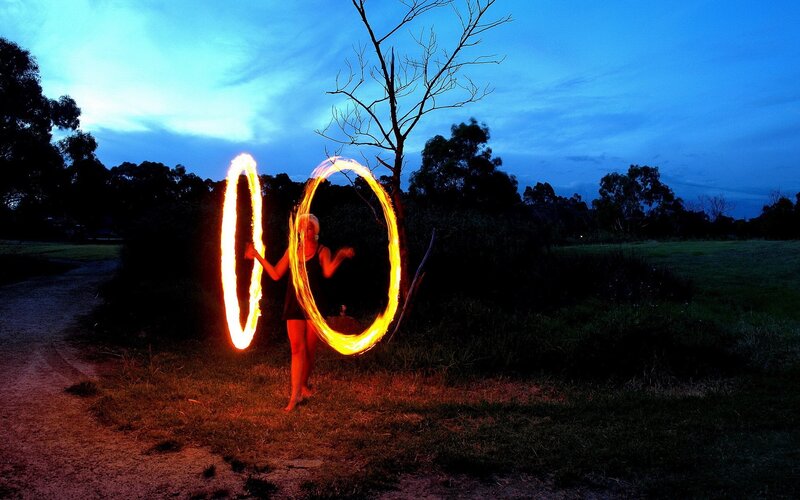 Fire dancer at dusk