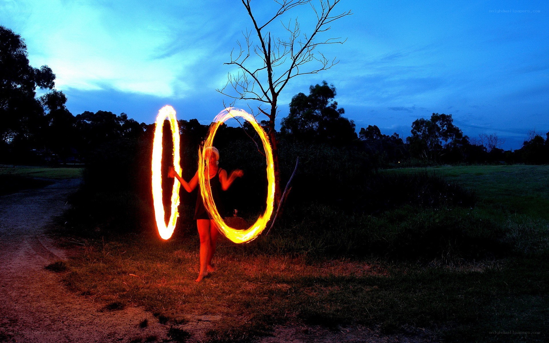 Fire dancer at dusk