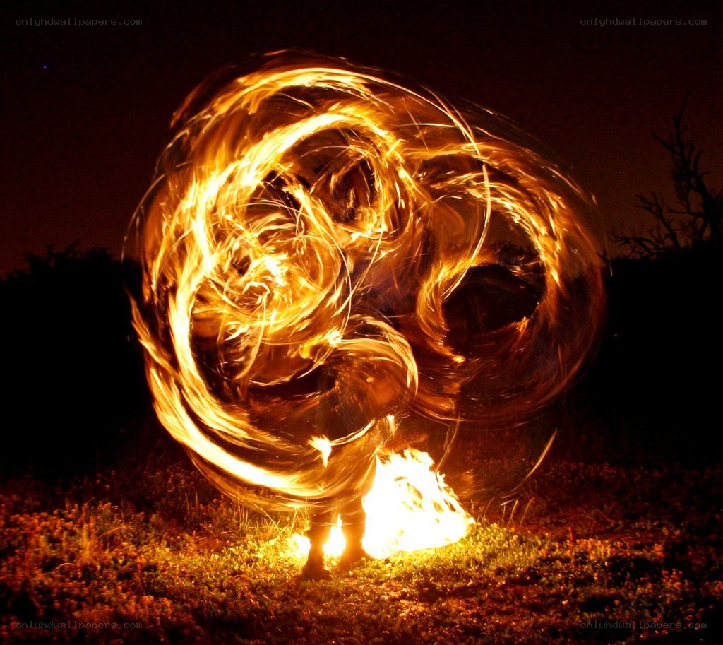 Fire dancer at night