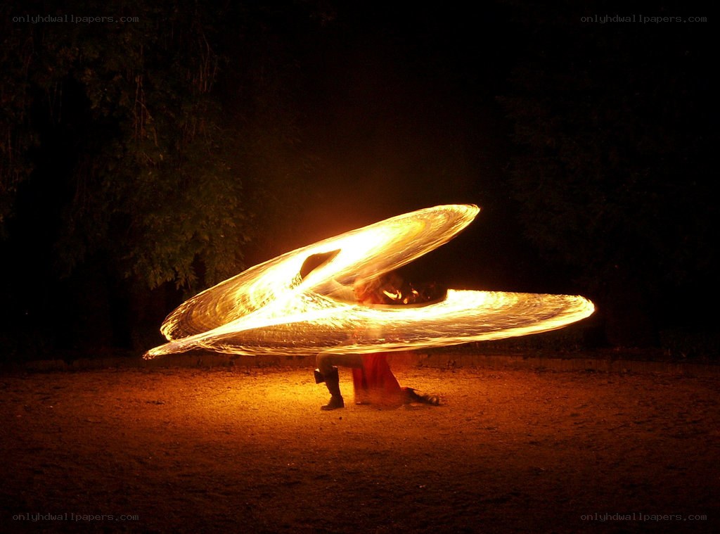 Fire dancer at night