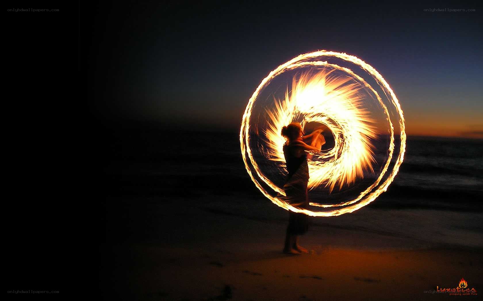 Fire dancer on the beach