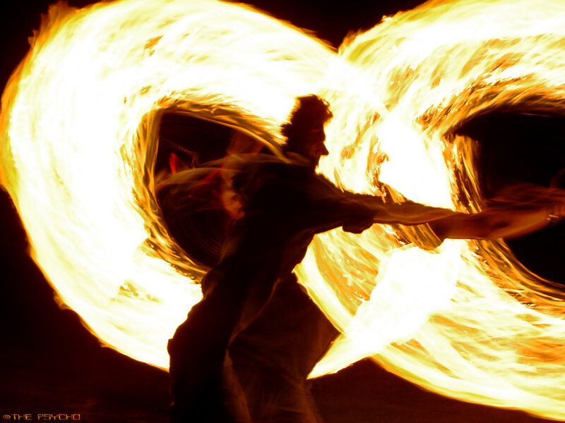 Fire dancer performing at night