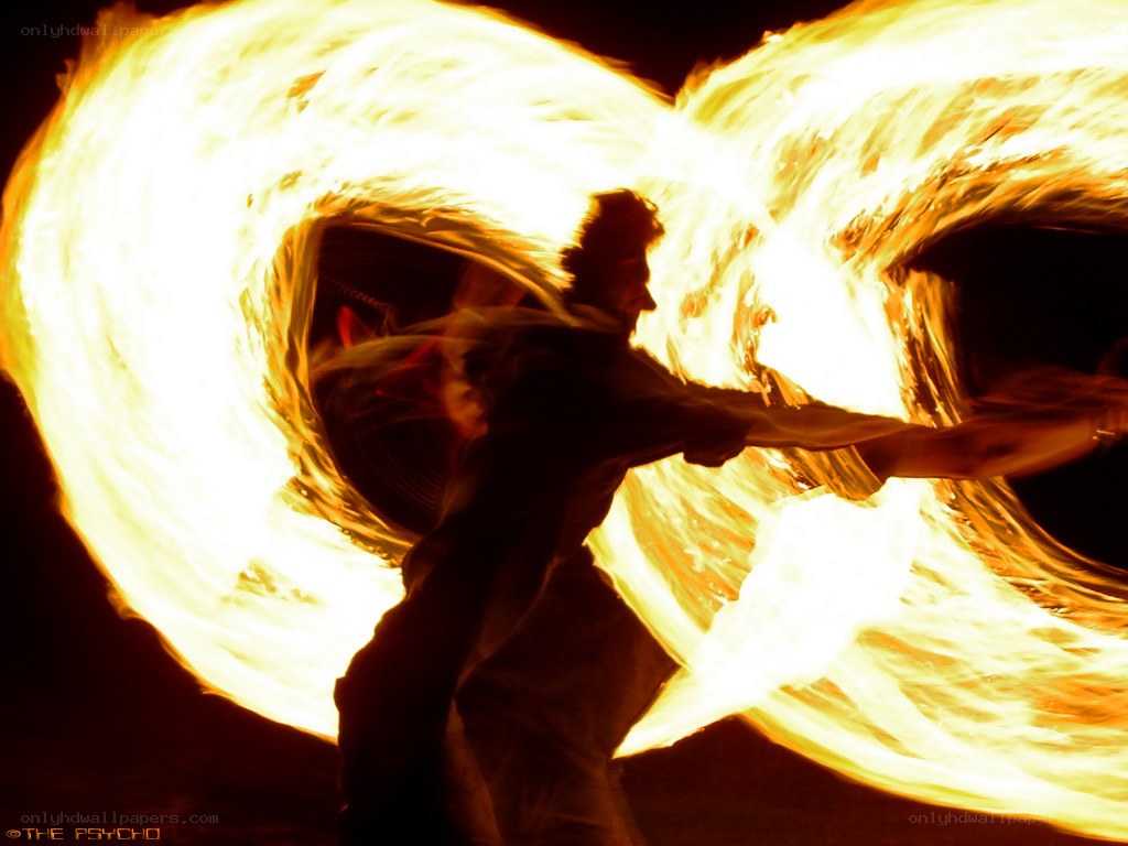 Fire dancer performing at night