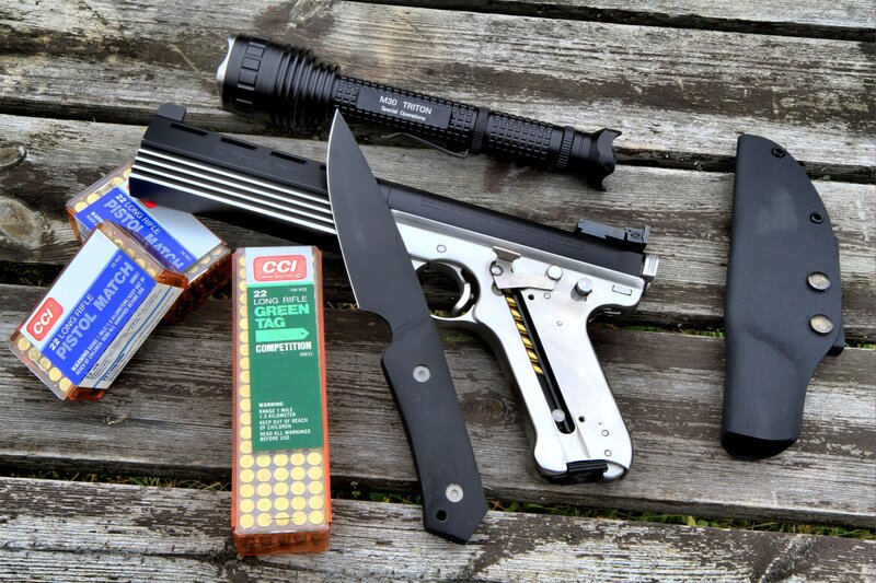 Firearms and accessories on wood
