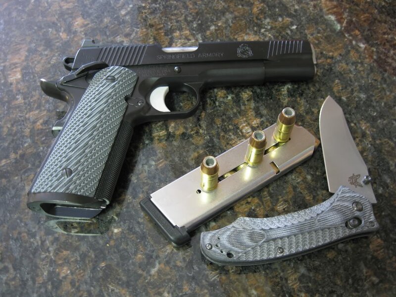 Firearms and knife on countertop