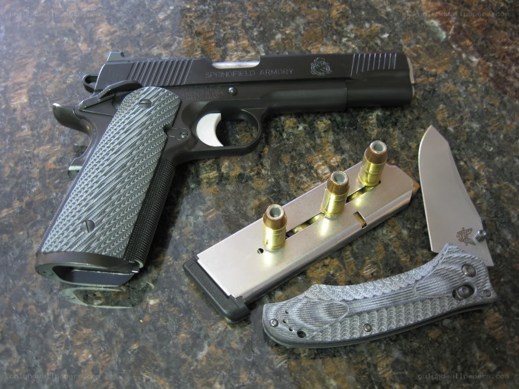 Firearms and knife on countertop