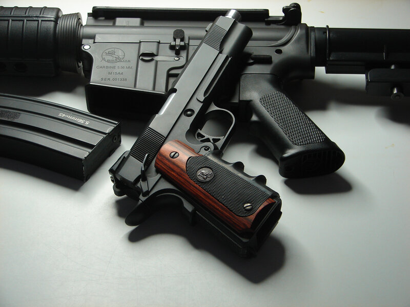 Firearms on a white surface