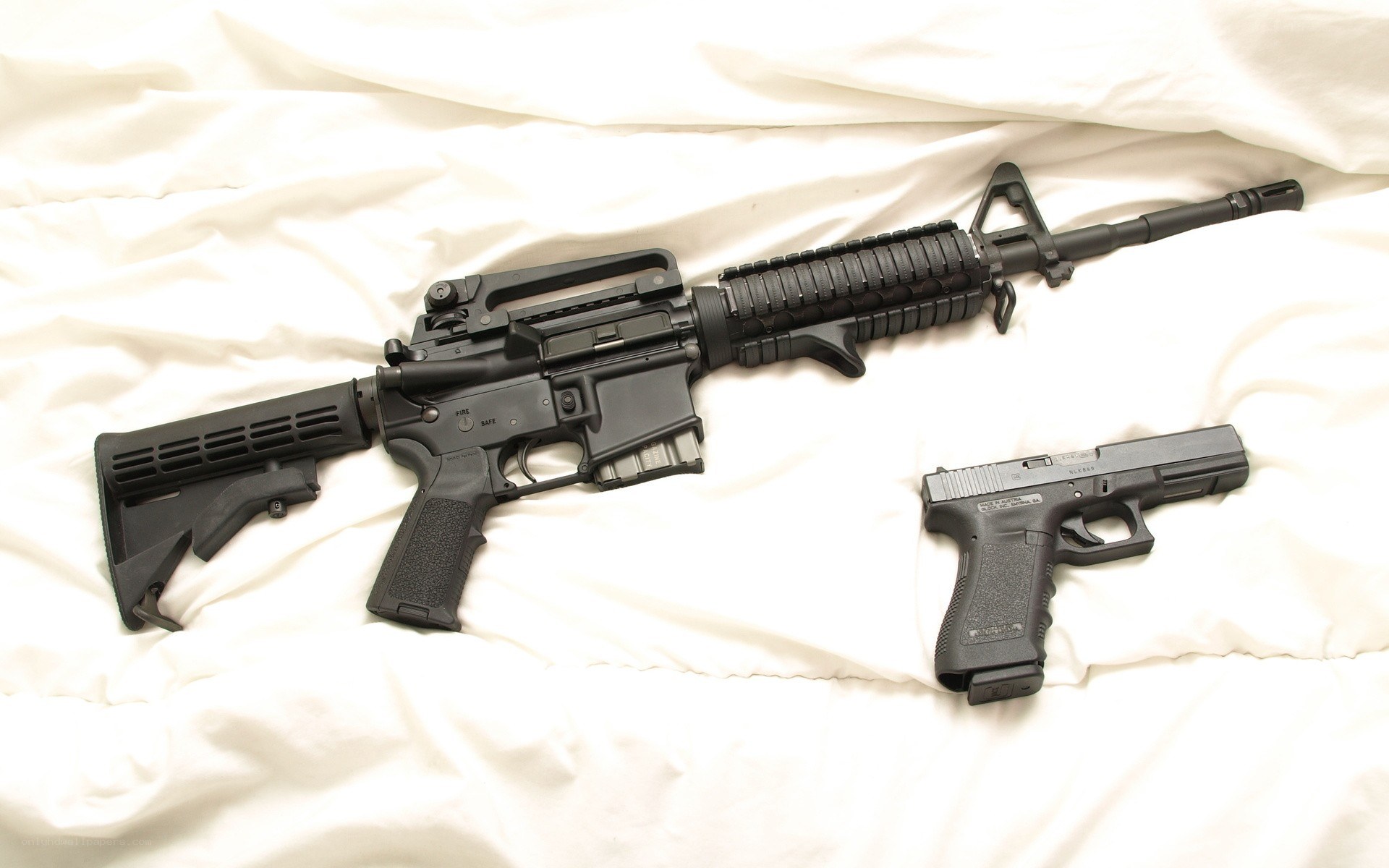Firearms on white fabric