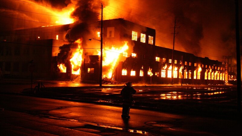 Firefighter at Burning Building — Orange
