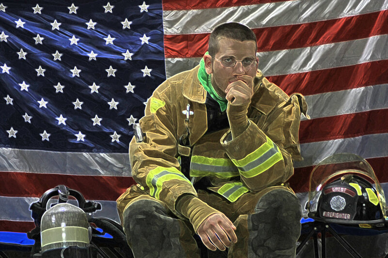 Firefighter in front of American flag