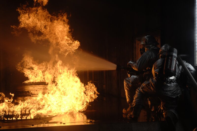 Firefighters Extinguishing Fire — Orange