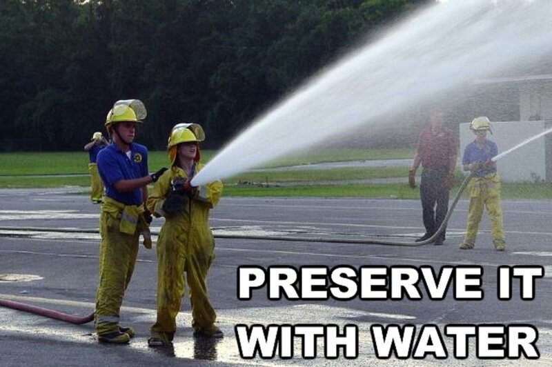 firefighters using water hose