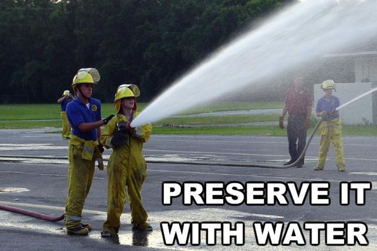 firefighters using water hose