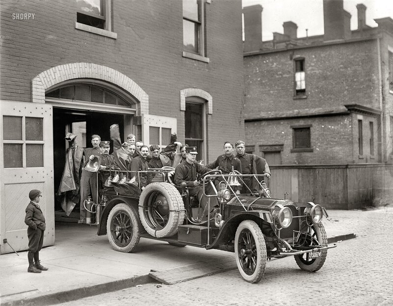 Firefighters with vintage fire truck