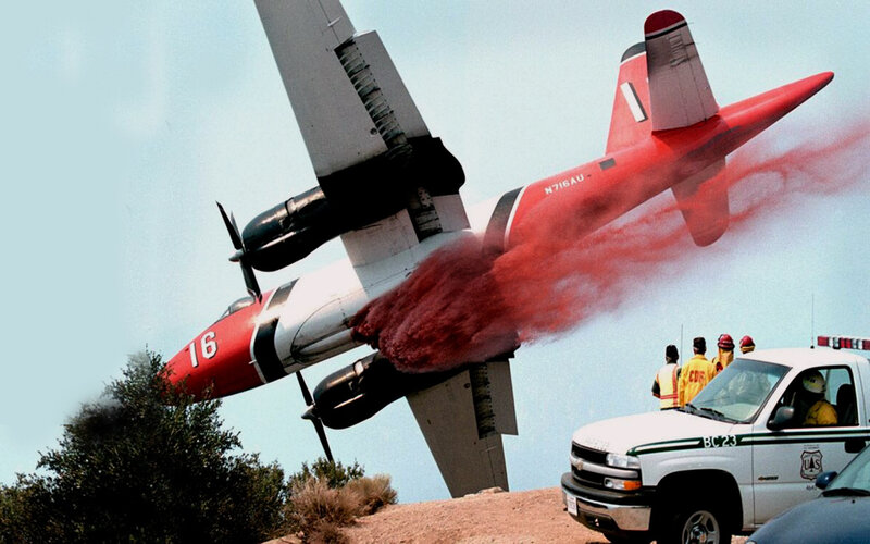 Firefighting plane dropping retardant