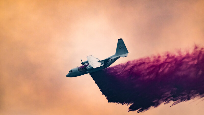 Firefighting Plane Dropping Retardant — Orange