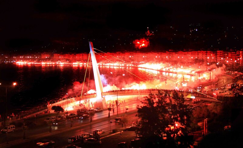 Fireworks at night by the bridge