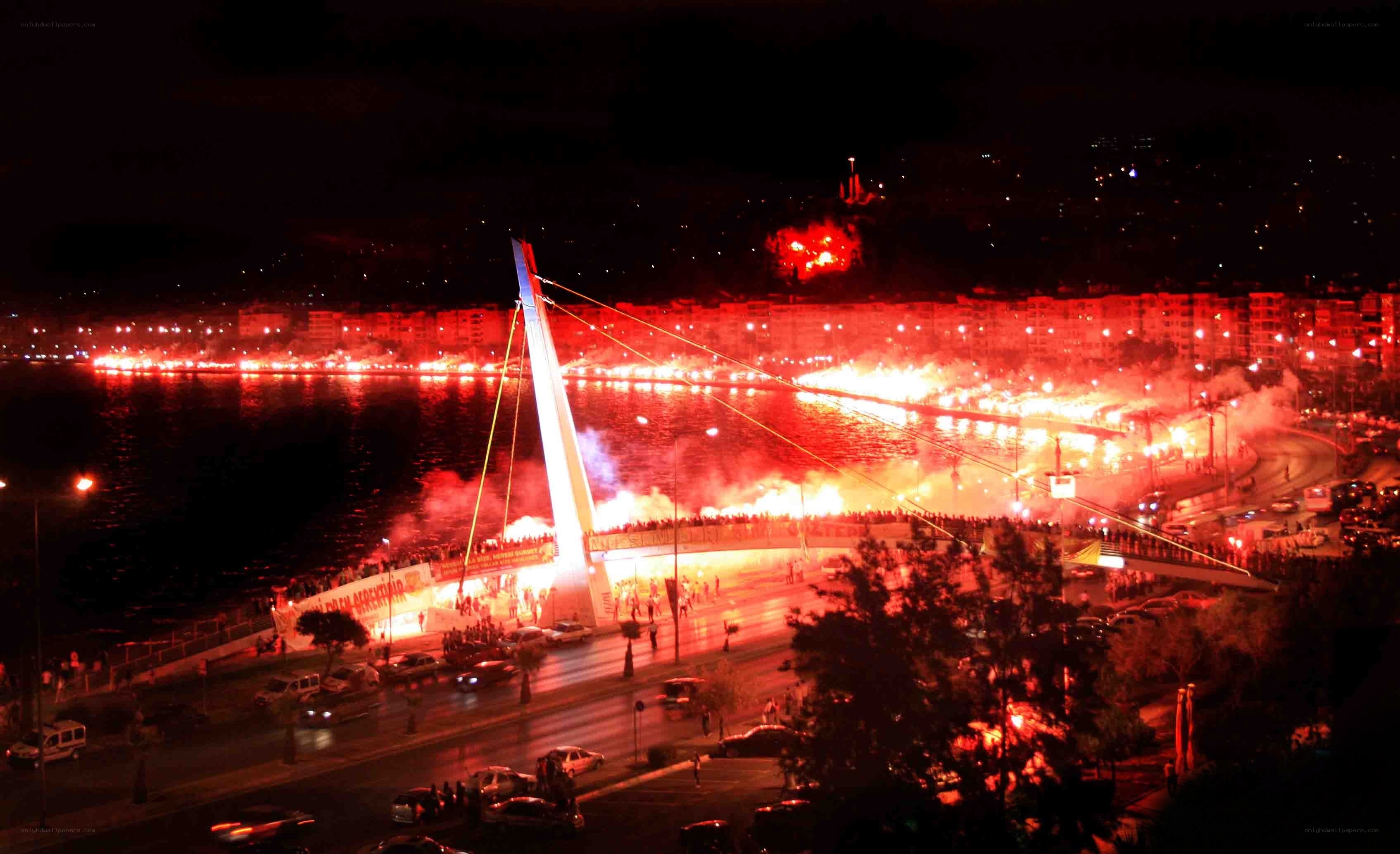Fireworks at night by the bridge