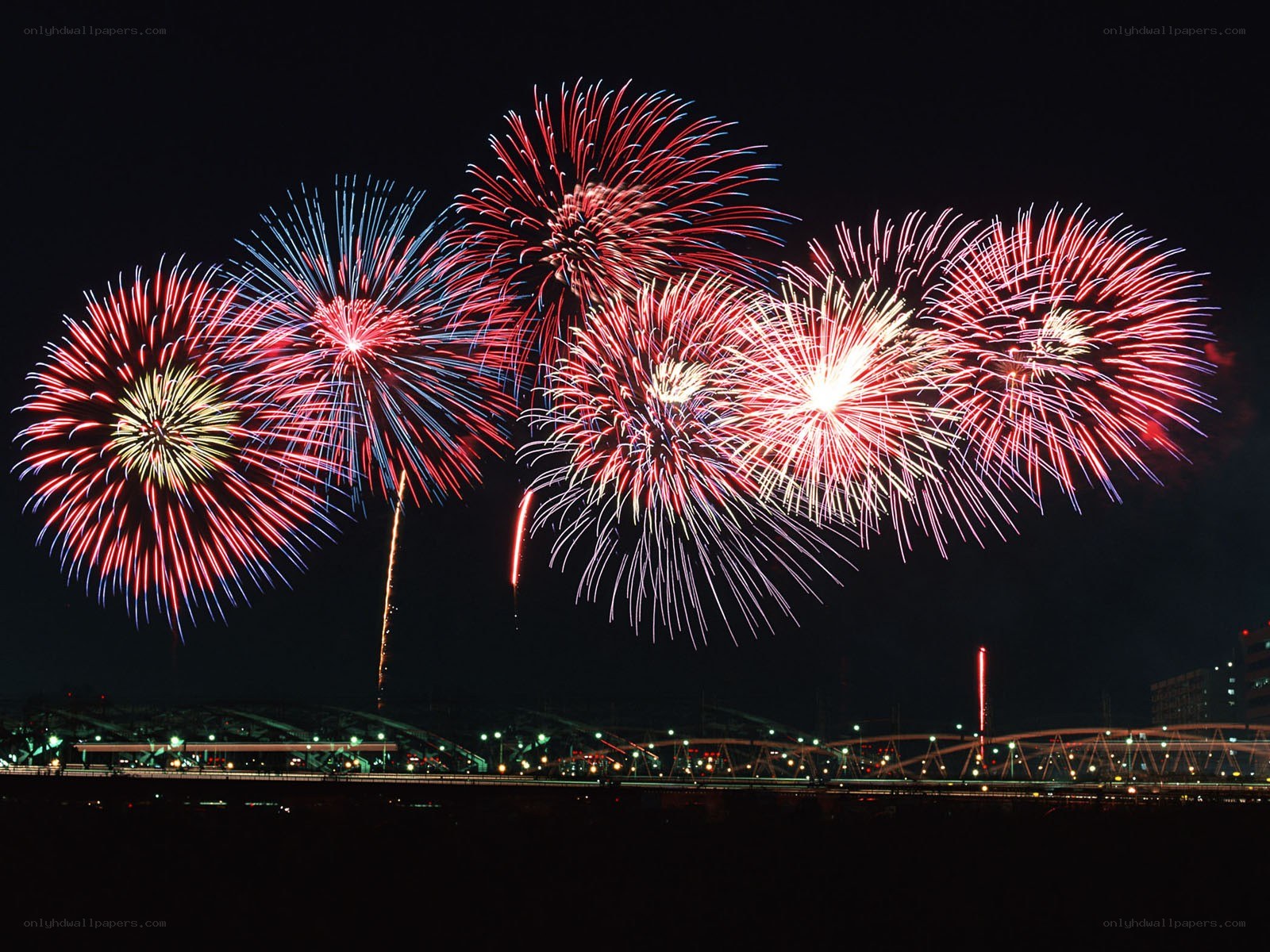 Fireworks display over a bridge