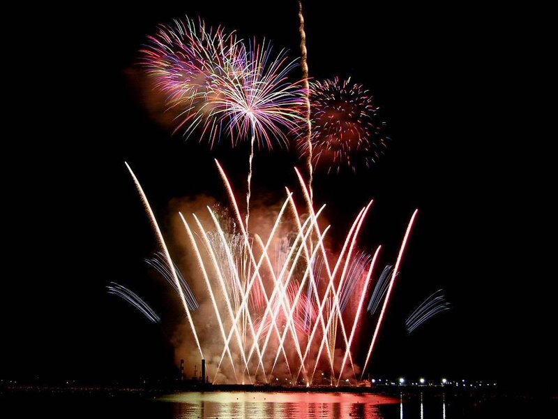 Fireworks Display over Water — Black, Dramatic