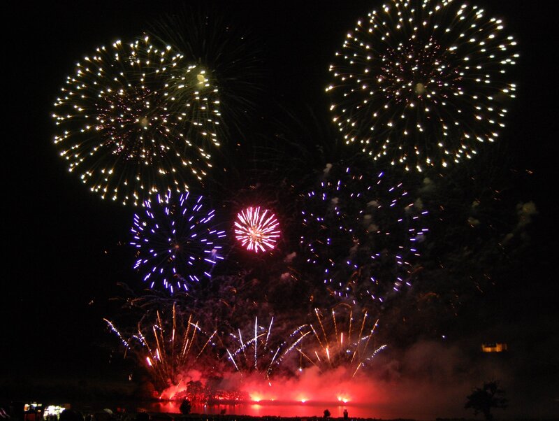 Fireworks Display over Water — Red, Dramatic, Night