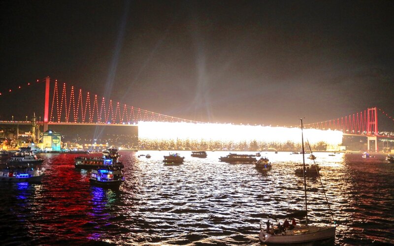 Fireworks over a bridge at night