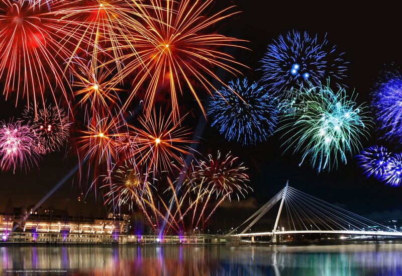 Fireworks over a bridge at night