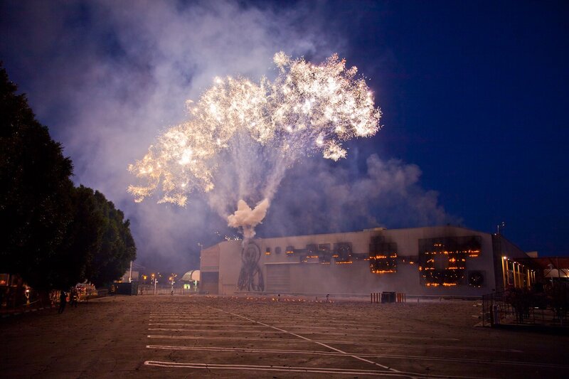 Fireworks over a burning building