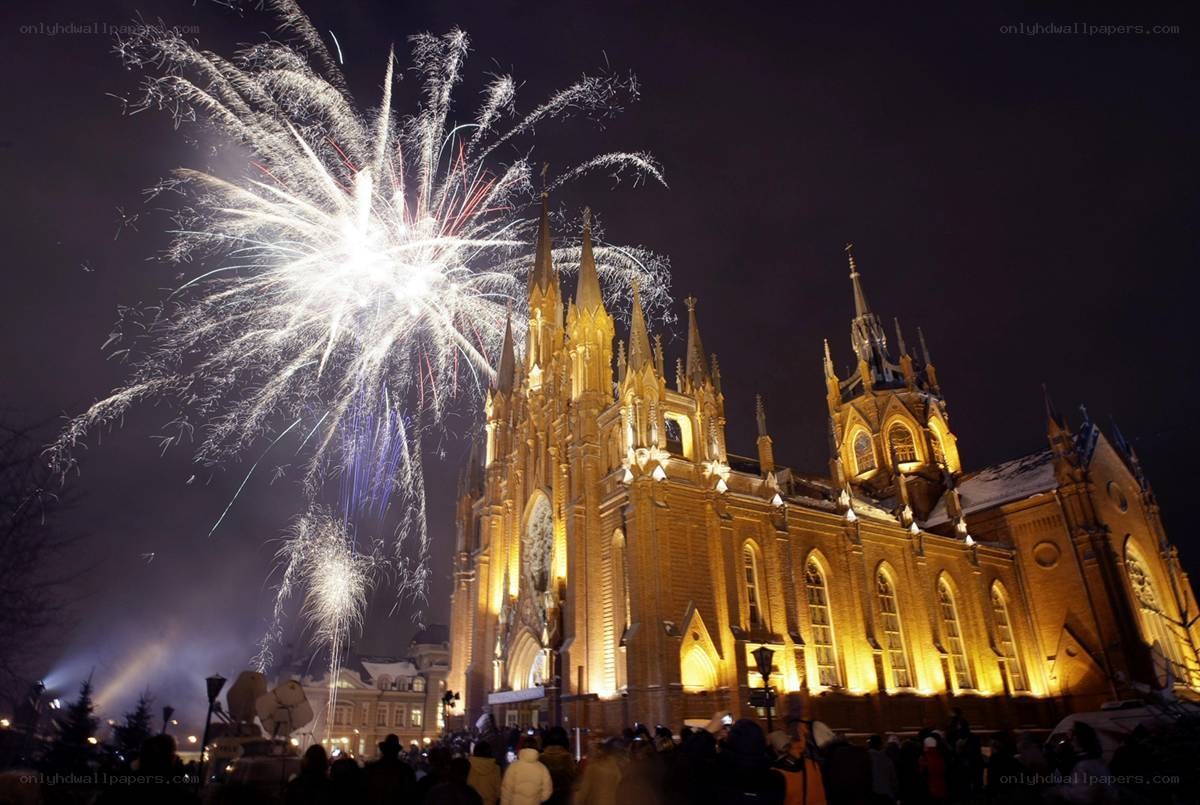 Fireworks over a cathedral at night