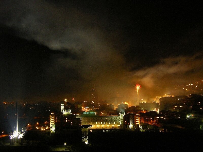 Fireworks over a city at night