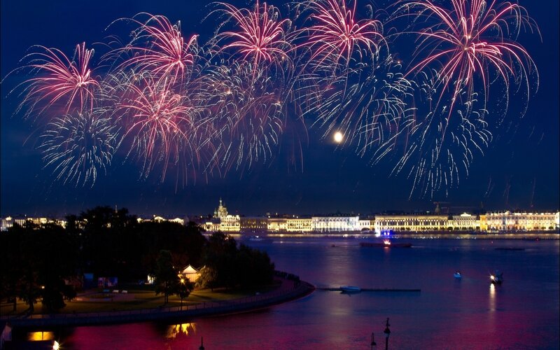 Fireworks over a city at night