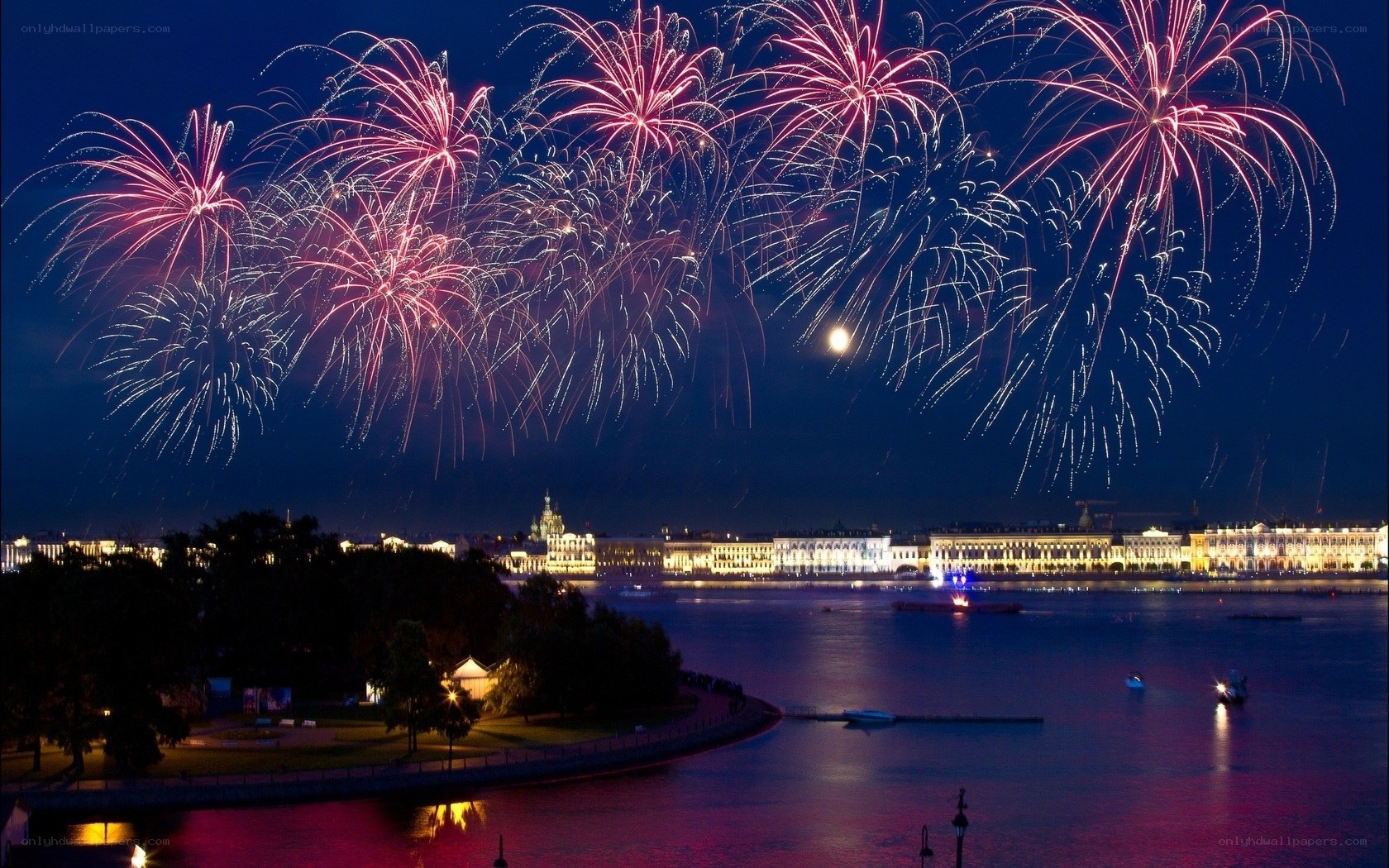 Fireworks over a city at night