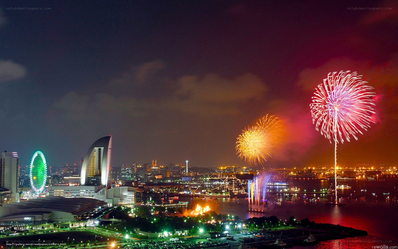 Fireworks over a city harbor