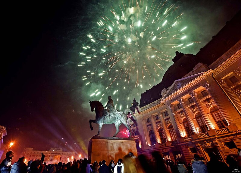 Fireworks over a city square