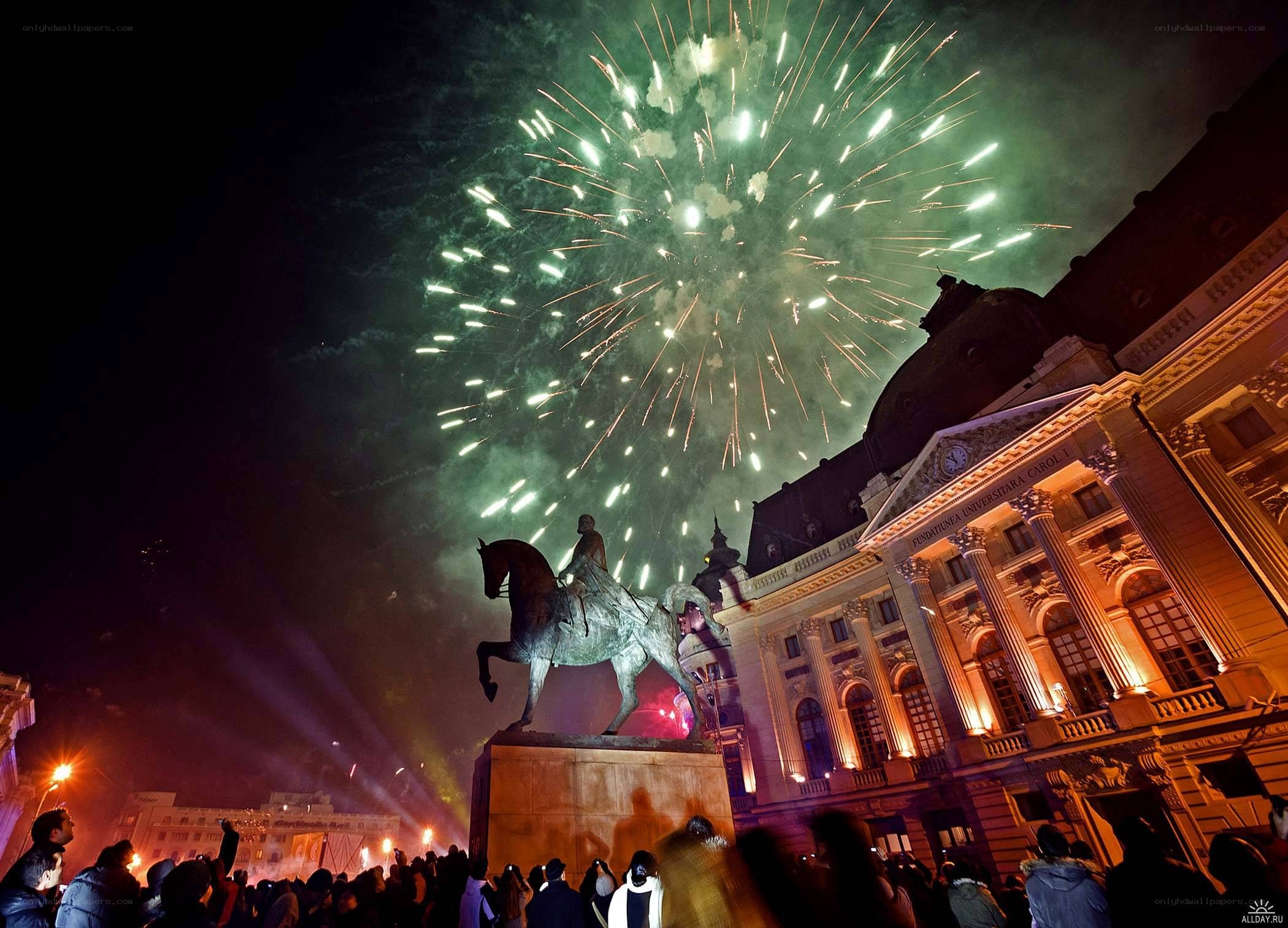 Fireworks over a city square