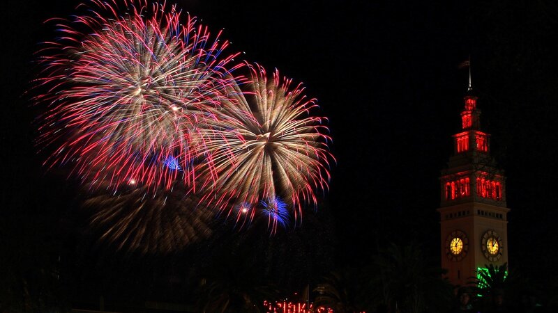 Fireworks over a clock tower