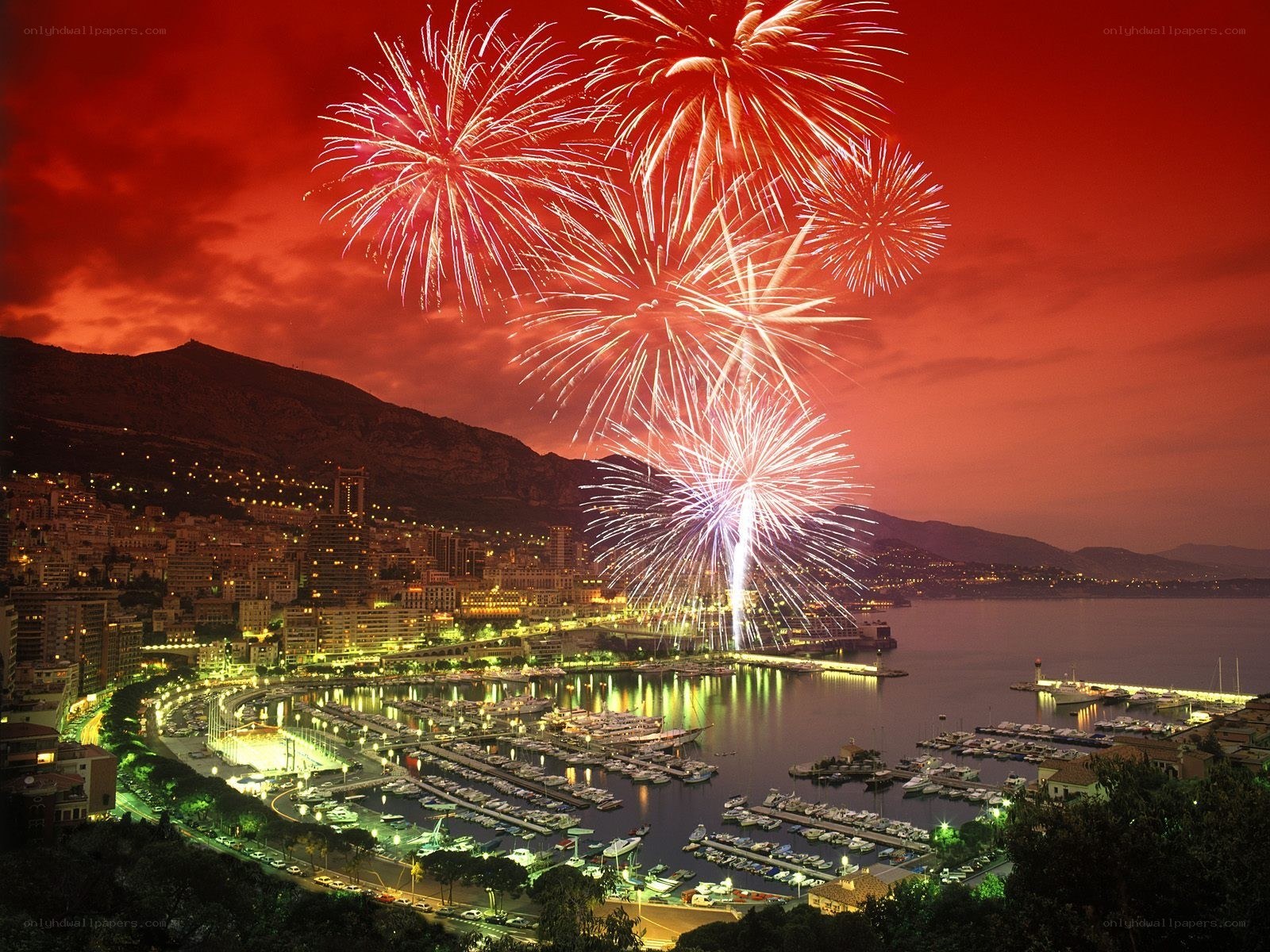 Fireworks over a coastal city