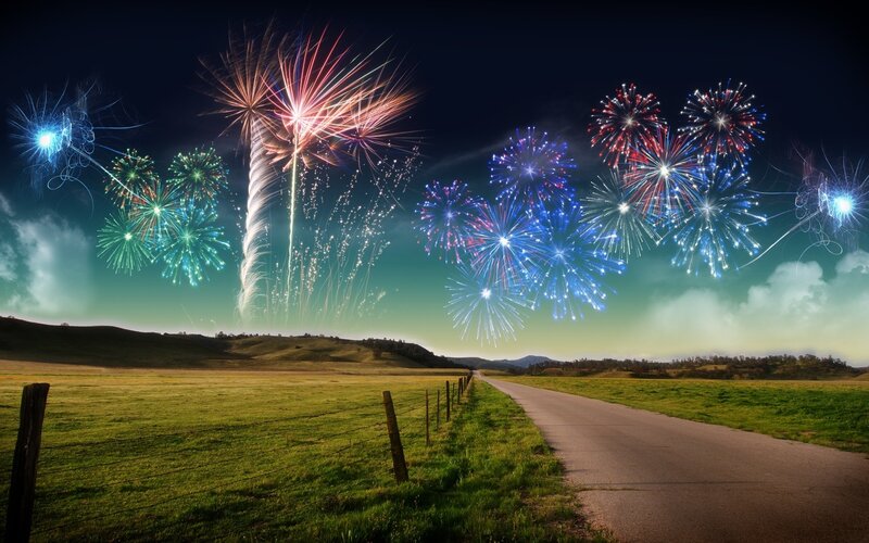 Fireworks over a country road