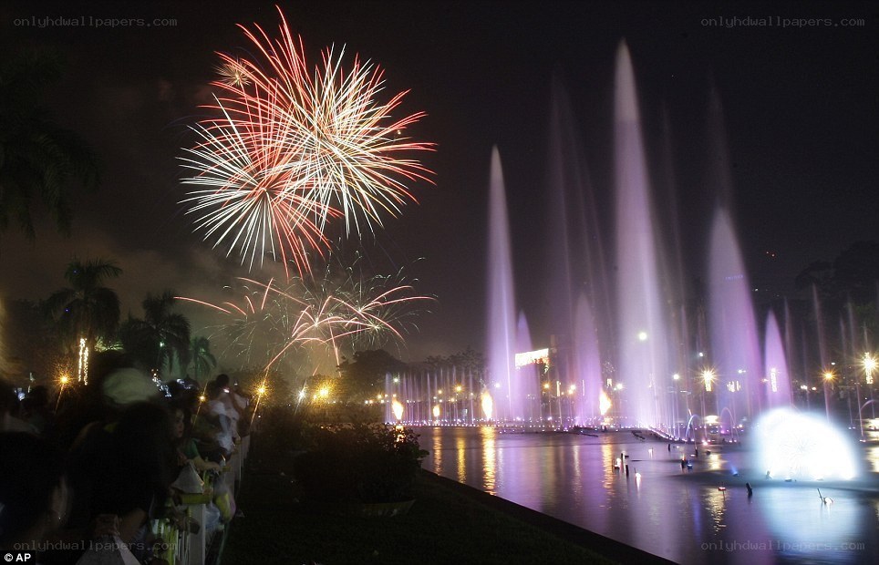 Fireworks over a fountain display