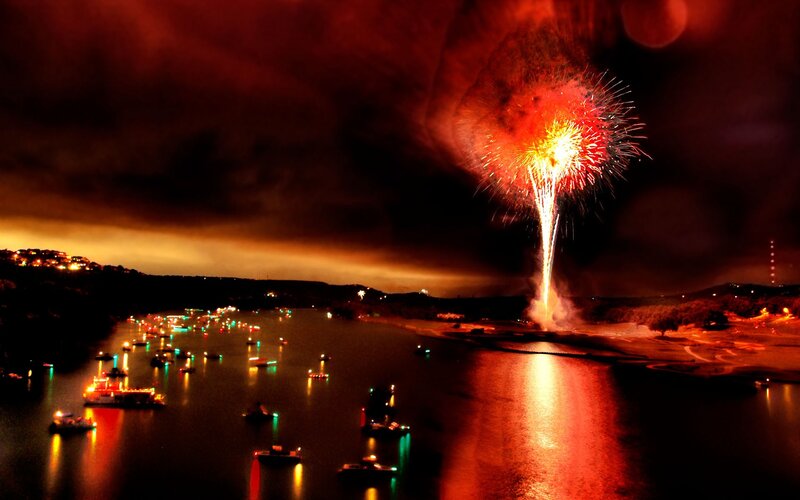 Fireworks over a lake at night
