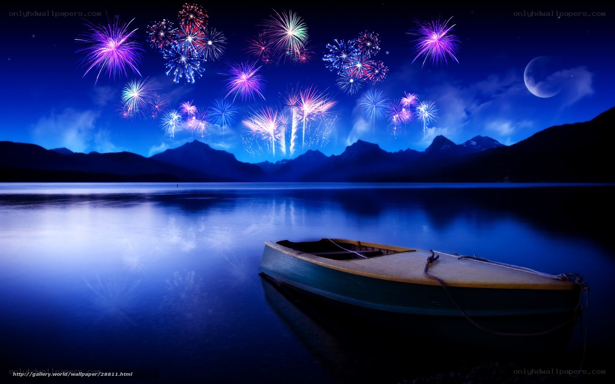 Fireworks over a lake at night