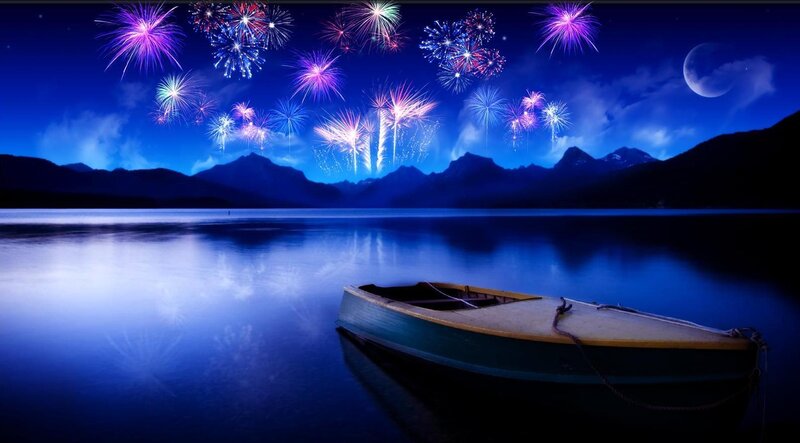 Fireworks over a lake at night