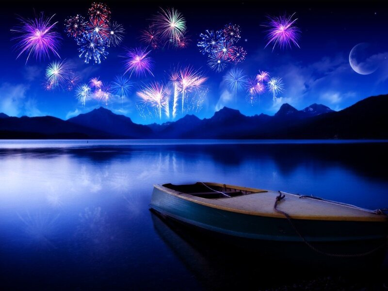 Fireworks over a lake at night