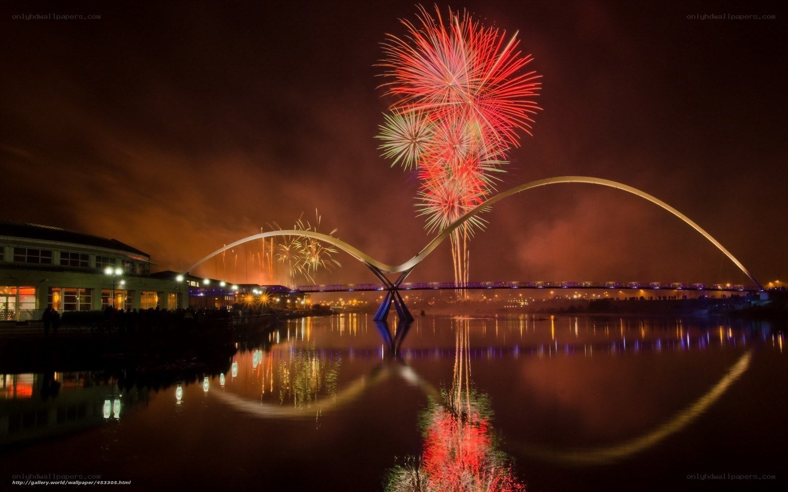 Fireworks over a modern bridge