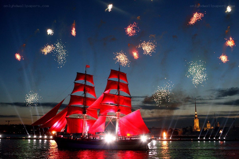Fireworks over a red-sailed ship