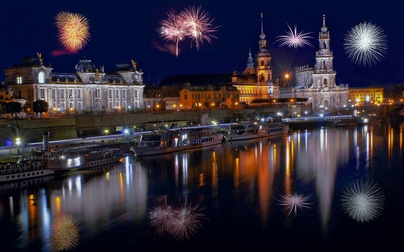 Fireworks over a river city