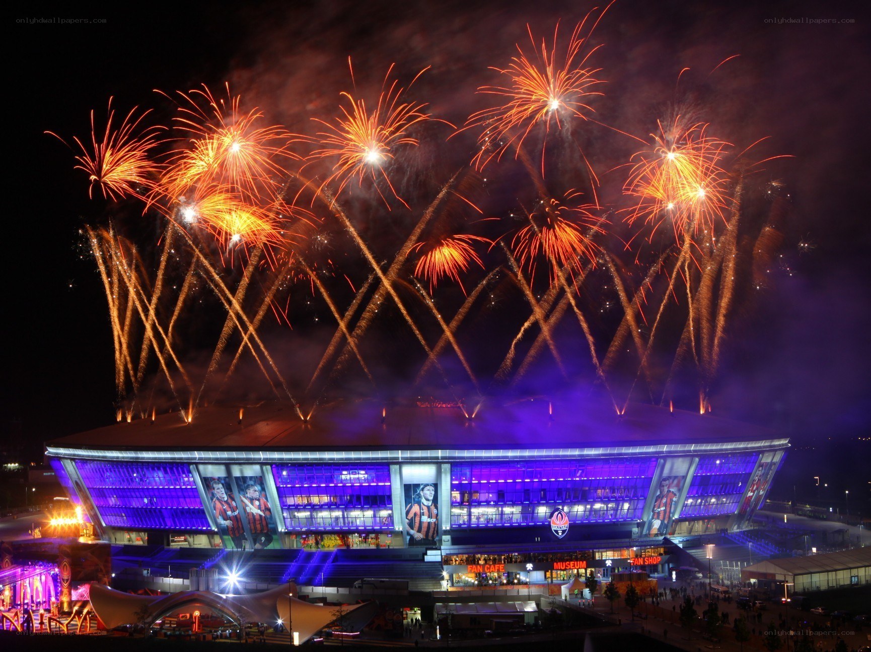 Fireworks over a stadium at night