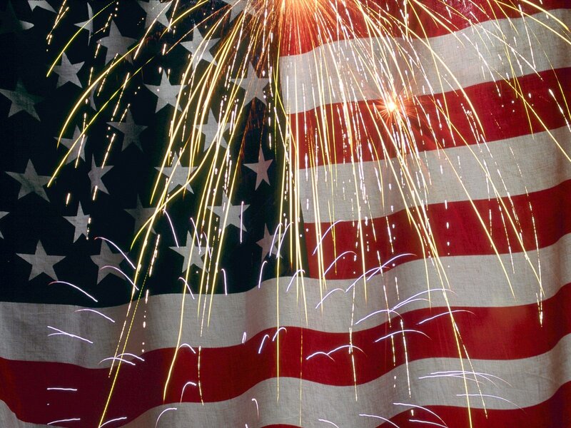 Fireworks over American flag